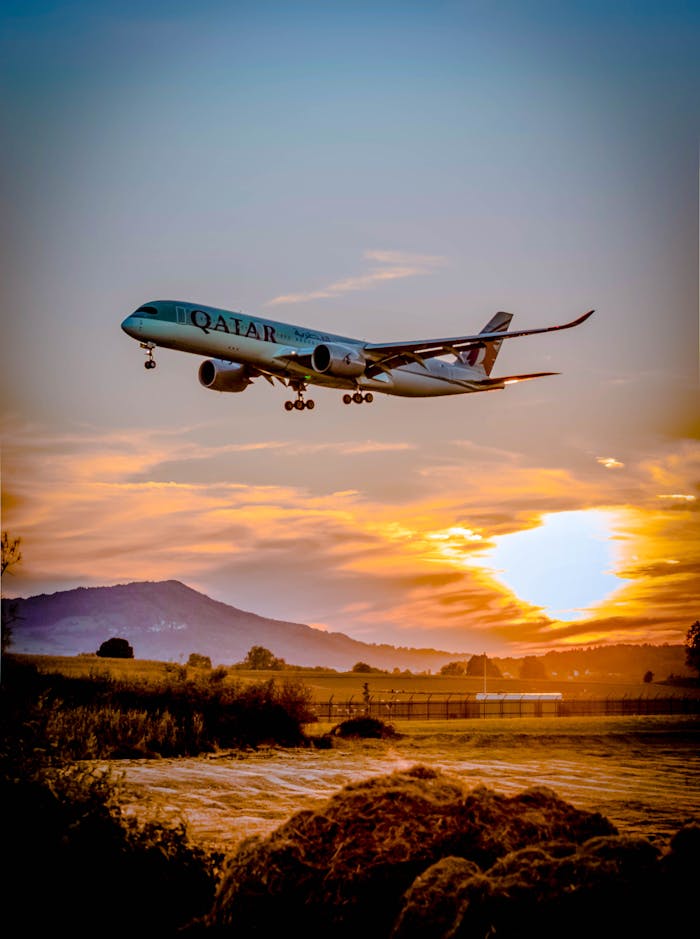 social-feed-img-02 A passenger airplane flying over a scenic landscape at sunset, capturing the aviation spirit.